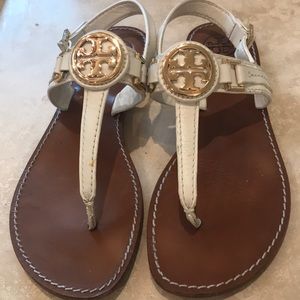 White sandals with Gold emblem, slightly worn